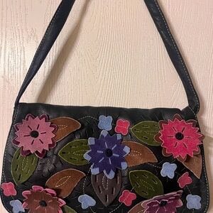 “Floral” eather and suede purse.